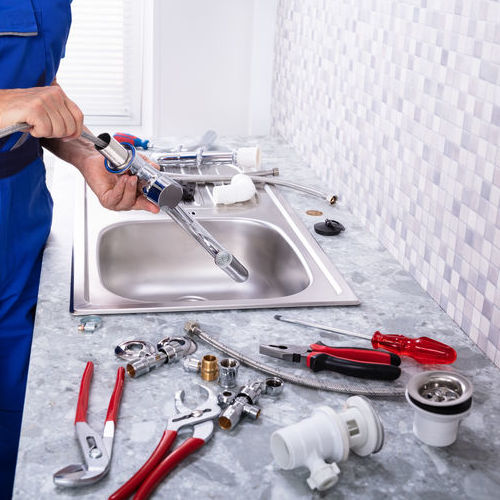 An Assembly of Plumbing Tools Laid On Counter