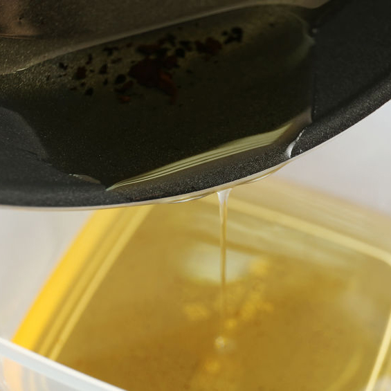 oil being poured in tupperware