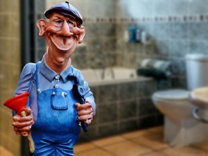 a photo of a plumber figurine holding a plunger